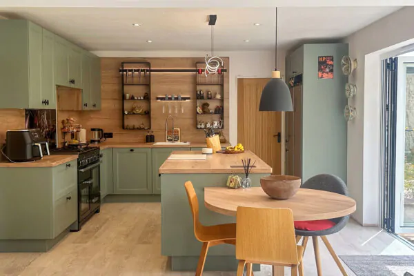 Traditional Reed Green Kitchen with Oak Accents