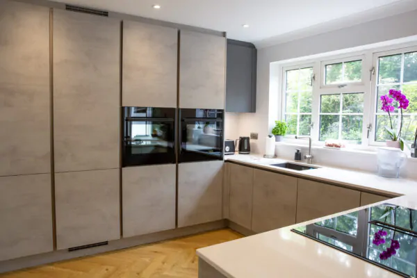 Industrial Kitchen Renovation with Stone Finish and Oak Breakfast Bar
