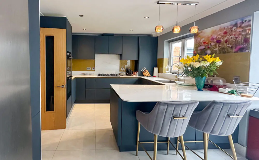 Modern kitchen with gold Line N cabinets, American-style fridge freezer, and integrated storage
