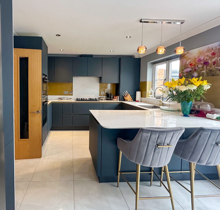 Modern kitchen with gold Line N cabinets, American-style fridge freezer, and integrated storage
