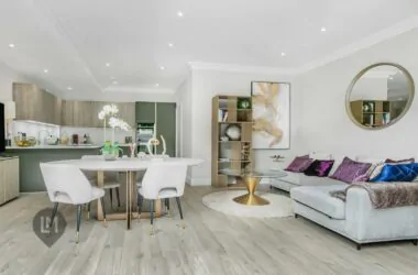 -plan living and dining area with stylish furnishings and light wood flooring in a 3-bed home at Camborne Mews, London