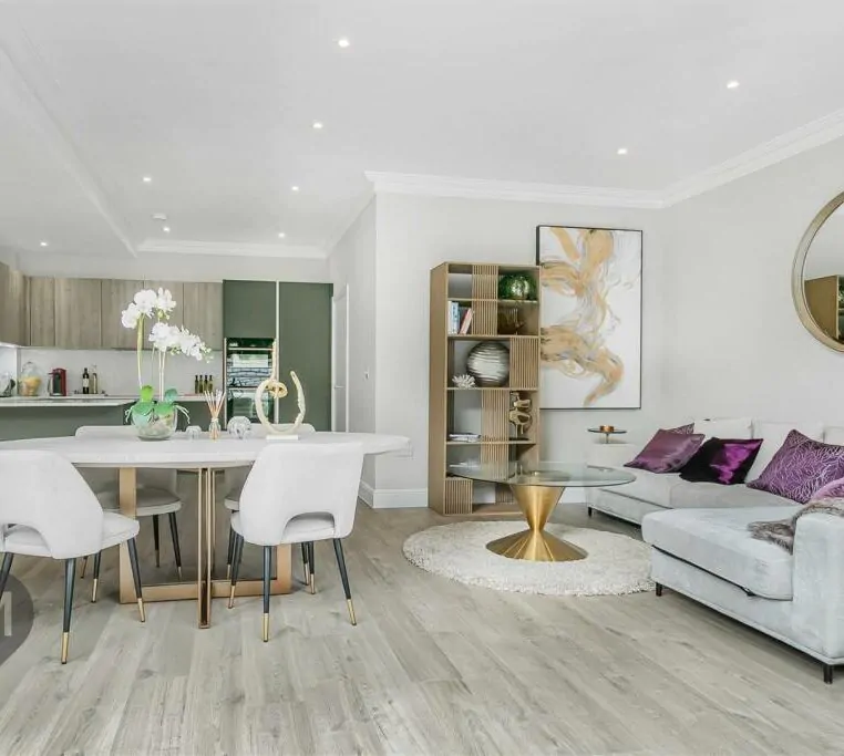 -plan living and dining area with stylish furnishings and light wood flooring in a 3-bed home at Camborne Mews, London