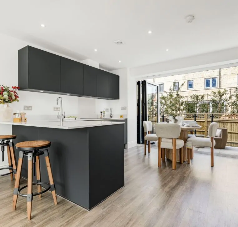 Contemporary kitchen with island and wooden bar stools