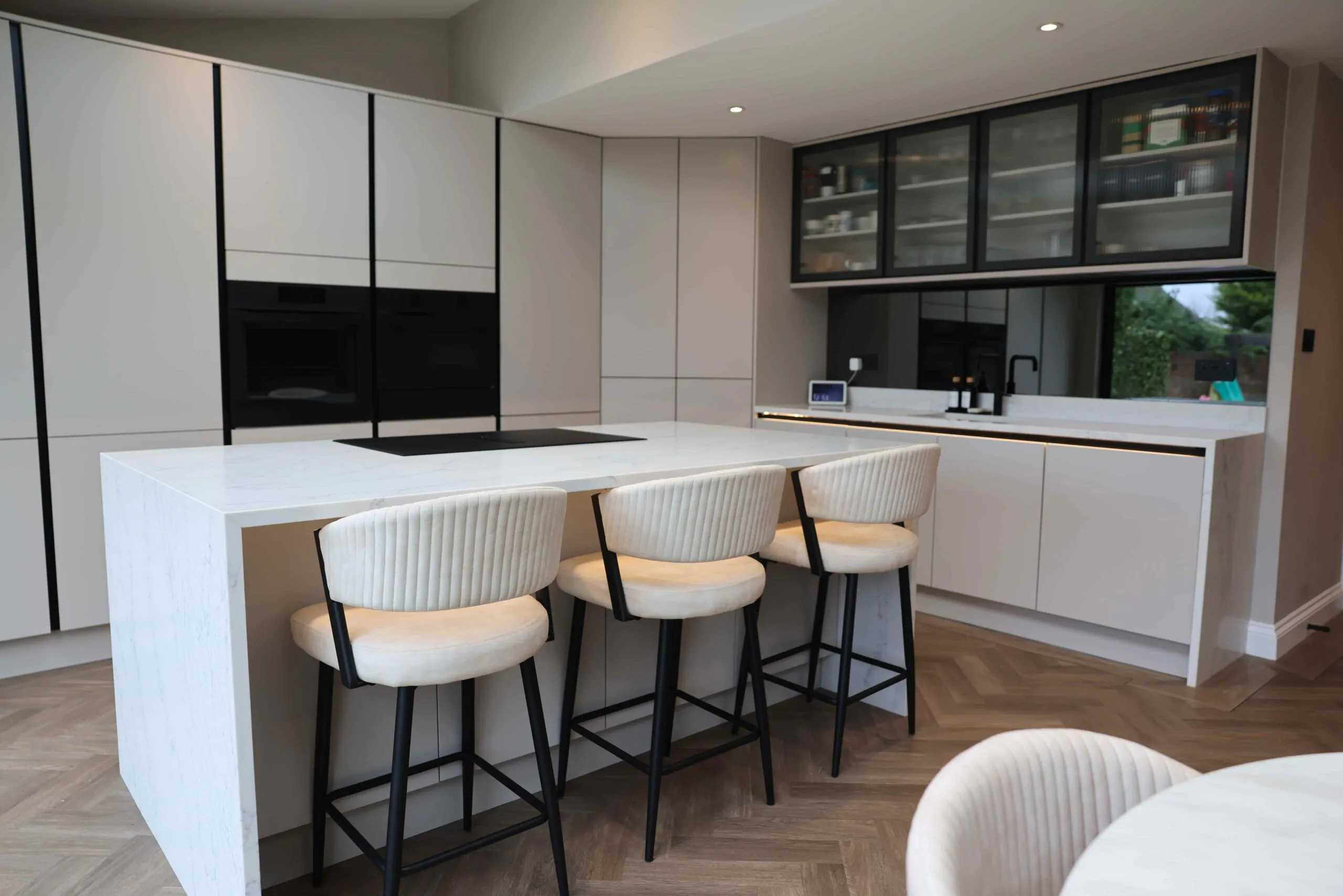 Contemporary White Handleless Kitchen with Statement Island & Glass Cabinets