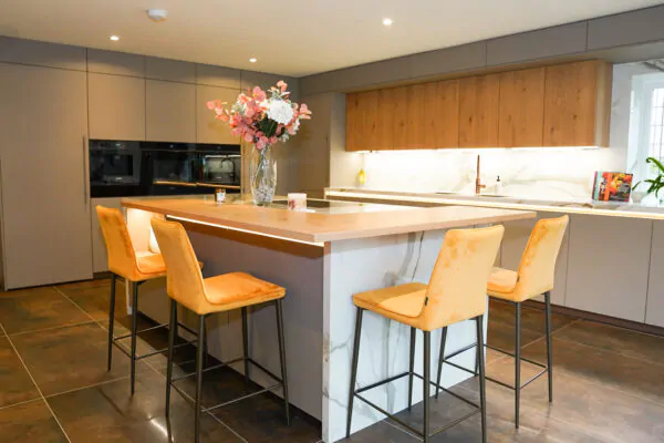 Contemporary Handleless Kitchen with Marble Waterfall Island, Media Wall & Bespoke Bar