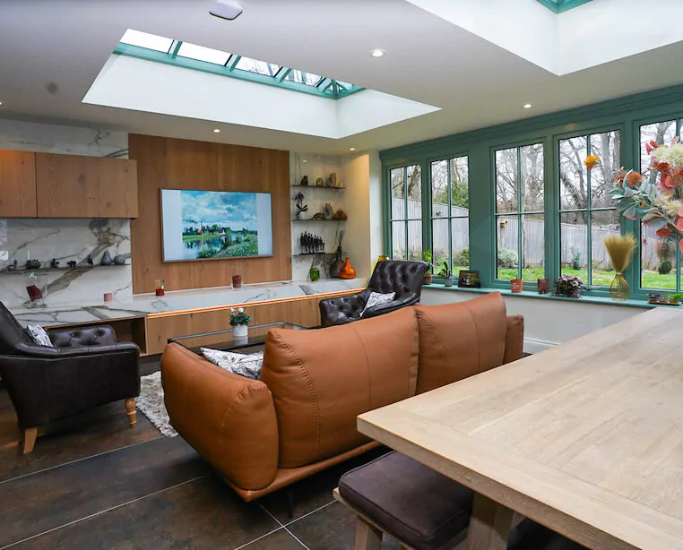 Kitchen extension with roof lantern and bespoke wall cabinetry.